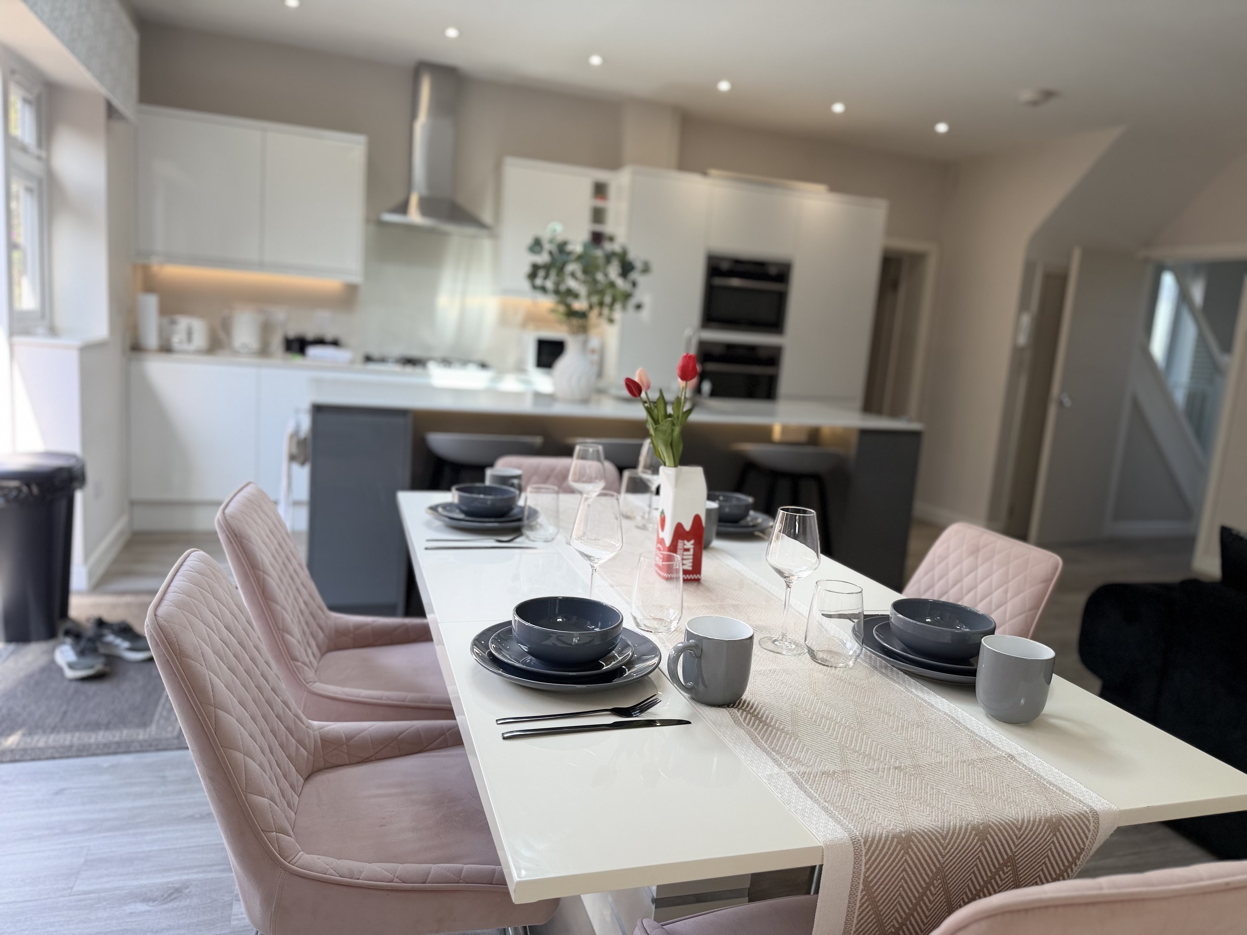 Borkwood Way dining table set for a meal beside the kitchen