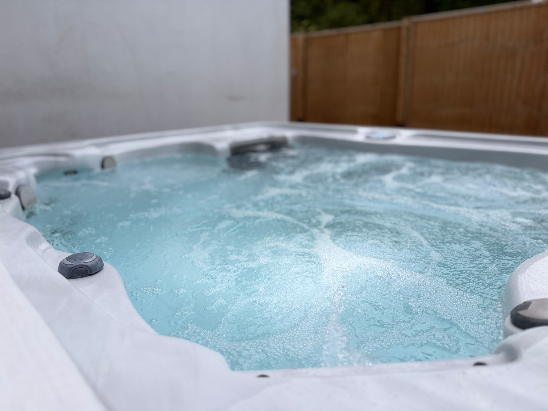 Close-up of the bubbling private hot tub at our managed Borkwood Way home in Orpington